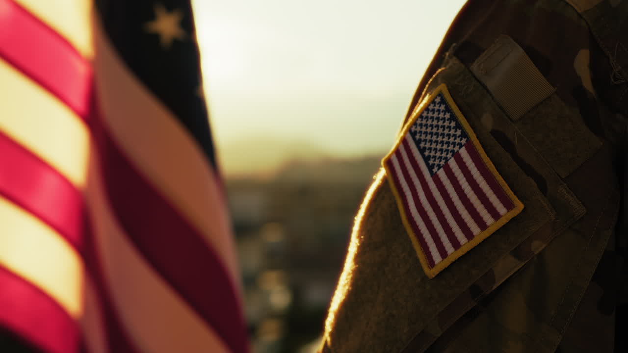 American Soldier Looks At American Flag On Memorial Day Celebration