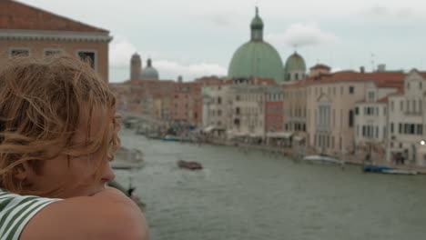 child gazing at venice historic architecture