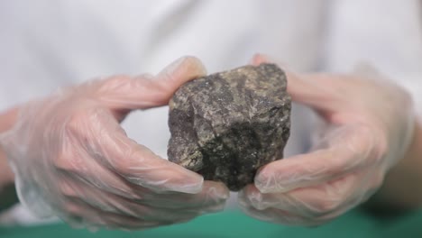 scientist examining a rock sample