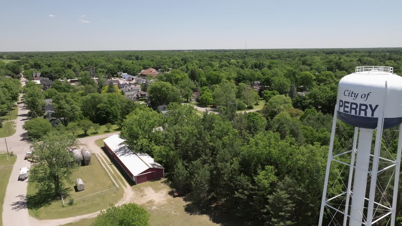 Perry, Michigan water tower with drone video moving forward
