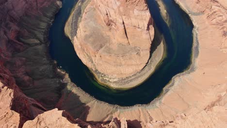 A-high-flying-drone-shot-over-Horseshoe-Bend,-the-“east-rim-of-the-Grand-Canyon”,-located-near-the-town-of-Page,-Arizona