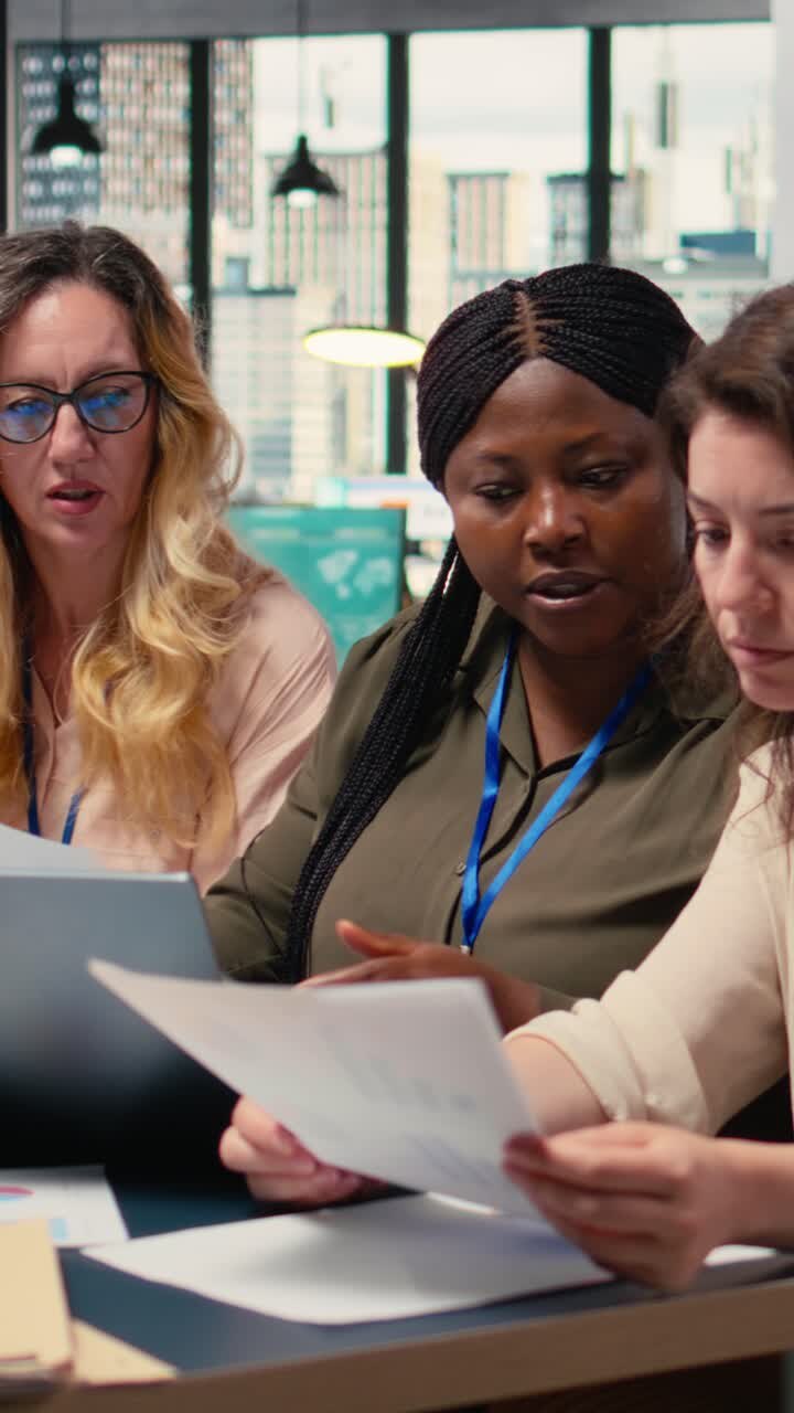 Vertical Video Businesswomen harness the power of analytics and teamwork