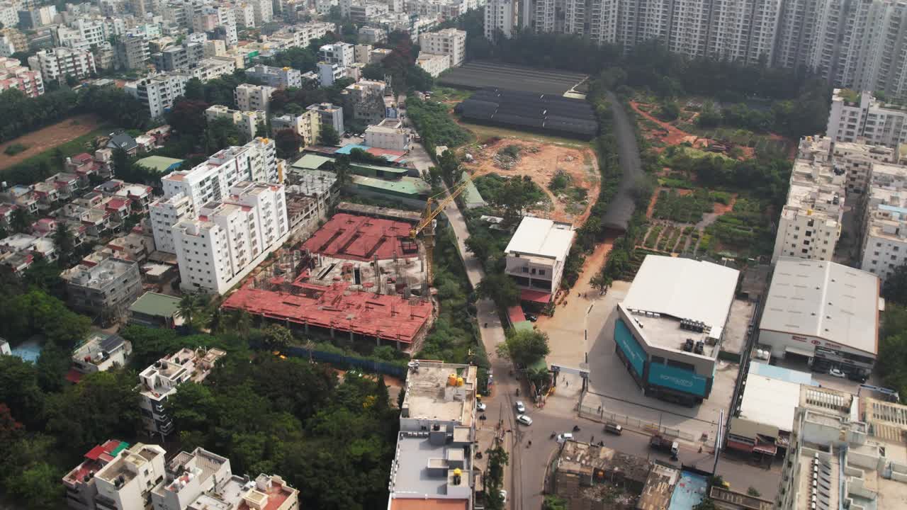 Aerial view of the Neeladri Road Electronics City Phase 1, Electronic City, Bengaluru, Karnataka construction site and busy intersection