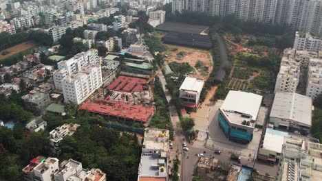 Aerial-view-of-the-Neeladri-Road-Electronics-City-Phase-1,-Electronic-City,-Bengaluru,-Karnataka-construction-site-and-busy-intersection