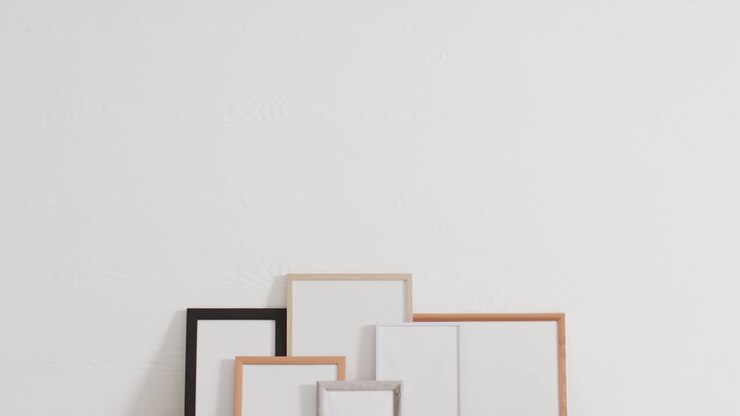 Set of frames with copy space on white background against white wall