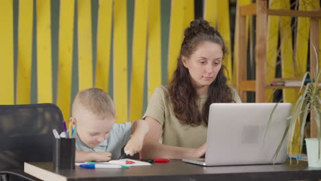 mother and child working from home