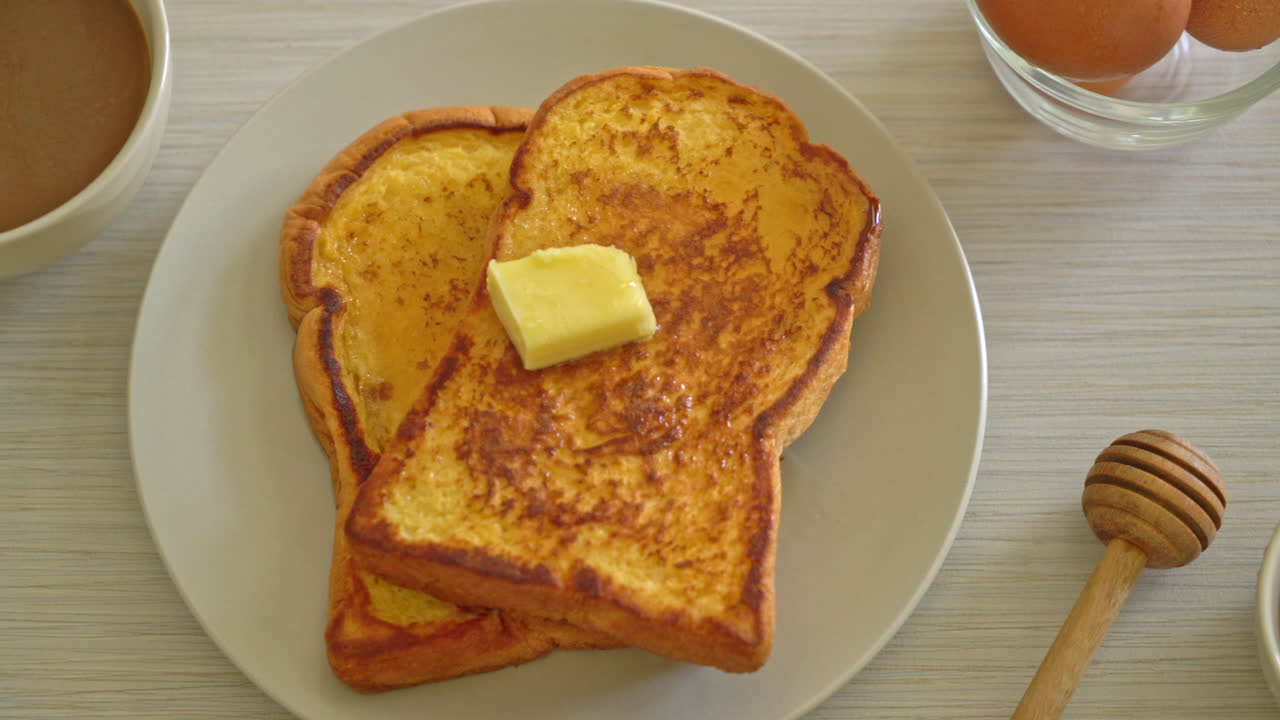 French toasted with butter and honey for breakfast