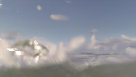 pov shot of slow motion waves crashing into shore including underwater perspective