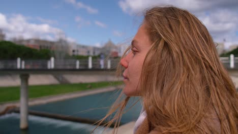 wind blowing hair of careless woman, sky background with copy space