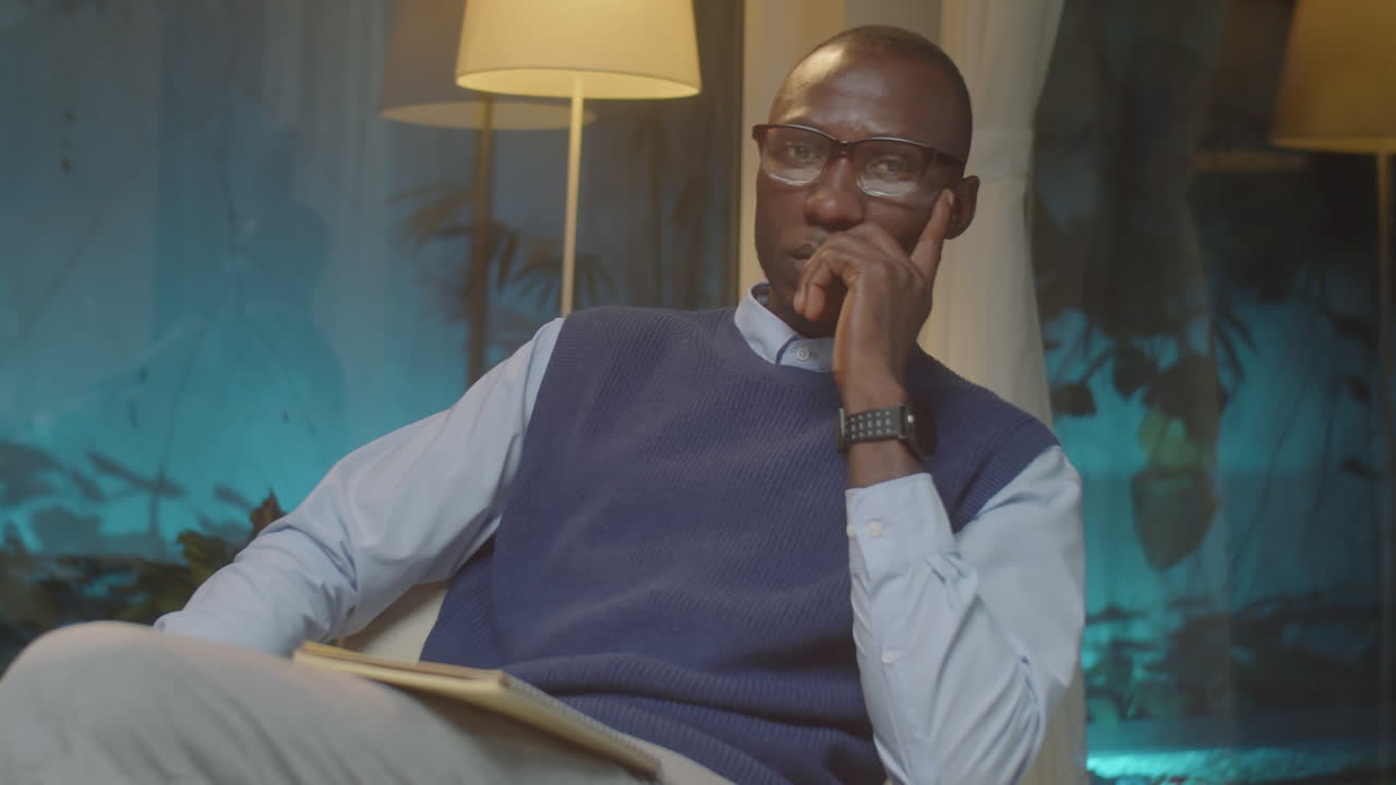 African American Psychologist Posing in His Office