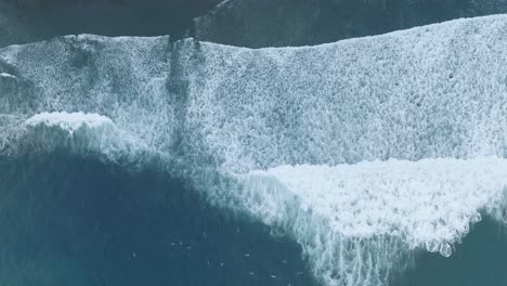 aerial top down drone view of surfers at la bocana el tunco el salvador