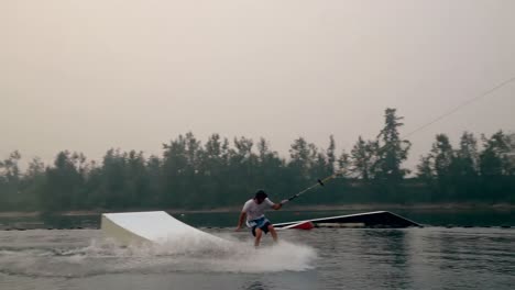 man wakeboarding in the river 4k