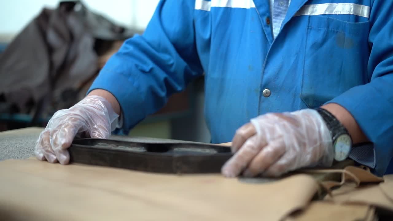 a craftsman handmade a shoe, close up shot, insert shot