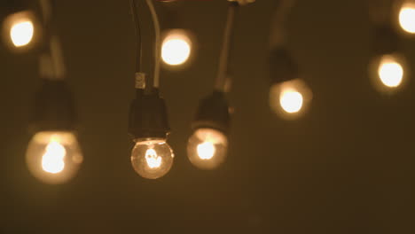 turning on small hanging light bulbs