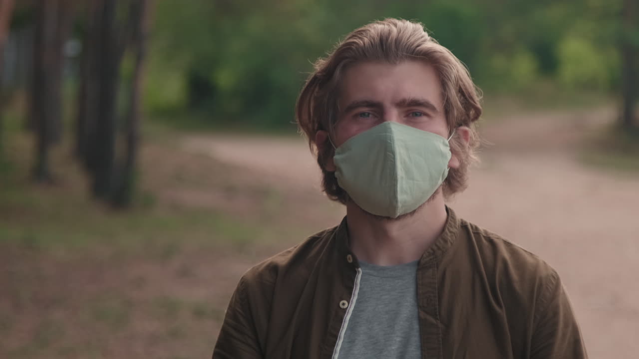 Portrait Of Man Wearing Face Mask In Woods