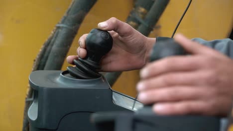 excavator operator controlling the machine