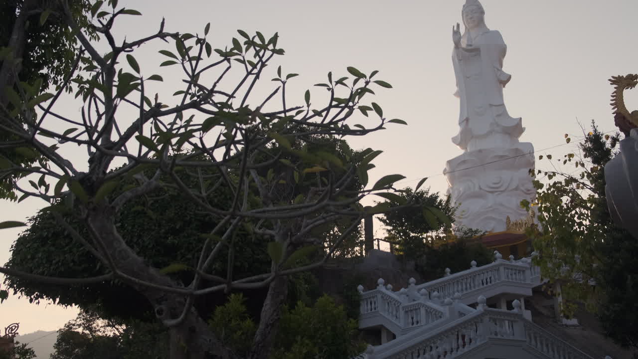 Buddhist Temple with White Statue and Gardens