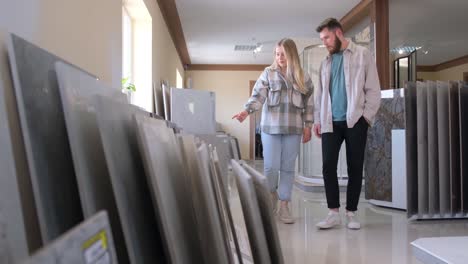 couple browsing tiles in a showroom