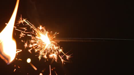 sparkler being lit with a match in slow motion.