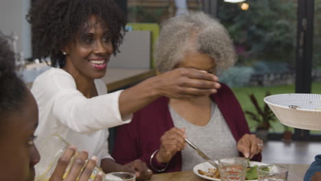 Mother-of-Family-Passing-Bowl-of-Potatoes-Across-the-Dining-Table-