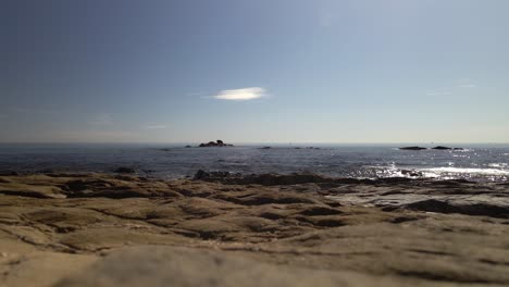 Low-fixed-frame-view-of-coastline-during-a-clear-day