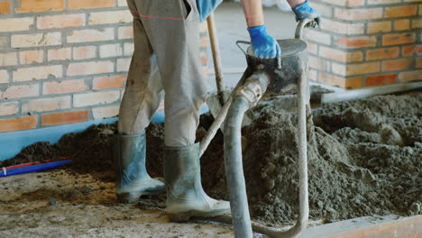 The-Builder-Puts-A-Semi-Dry-Mortar-For-Finishing-The-Floor