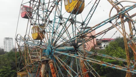 Hanoi-abandoned-ferris-wheel-during-day-time,-aerial