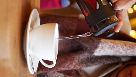 pouring tea into a cup