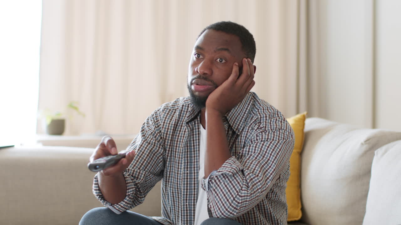 Man Bored Watching TV