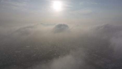 flying down from above clouds revealing lima cityscape, peru