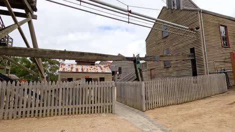 a video showcasing a historic mining site in ballarat, featuring wooden structures and fences under natural daylight
