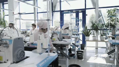 textile factory workers operating sewing machines