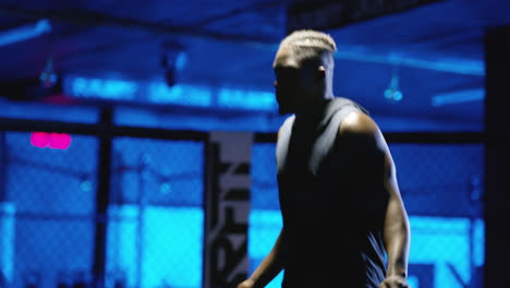man jumping rope in a gym