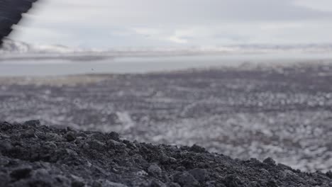 Close-up-of-tourist-boots-going-up-to-Hverfjall-volcano-crater,-Iceland