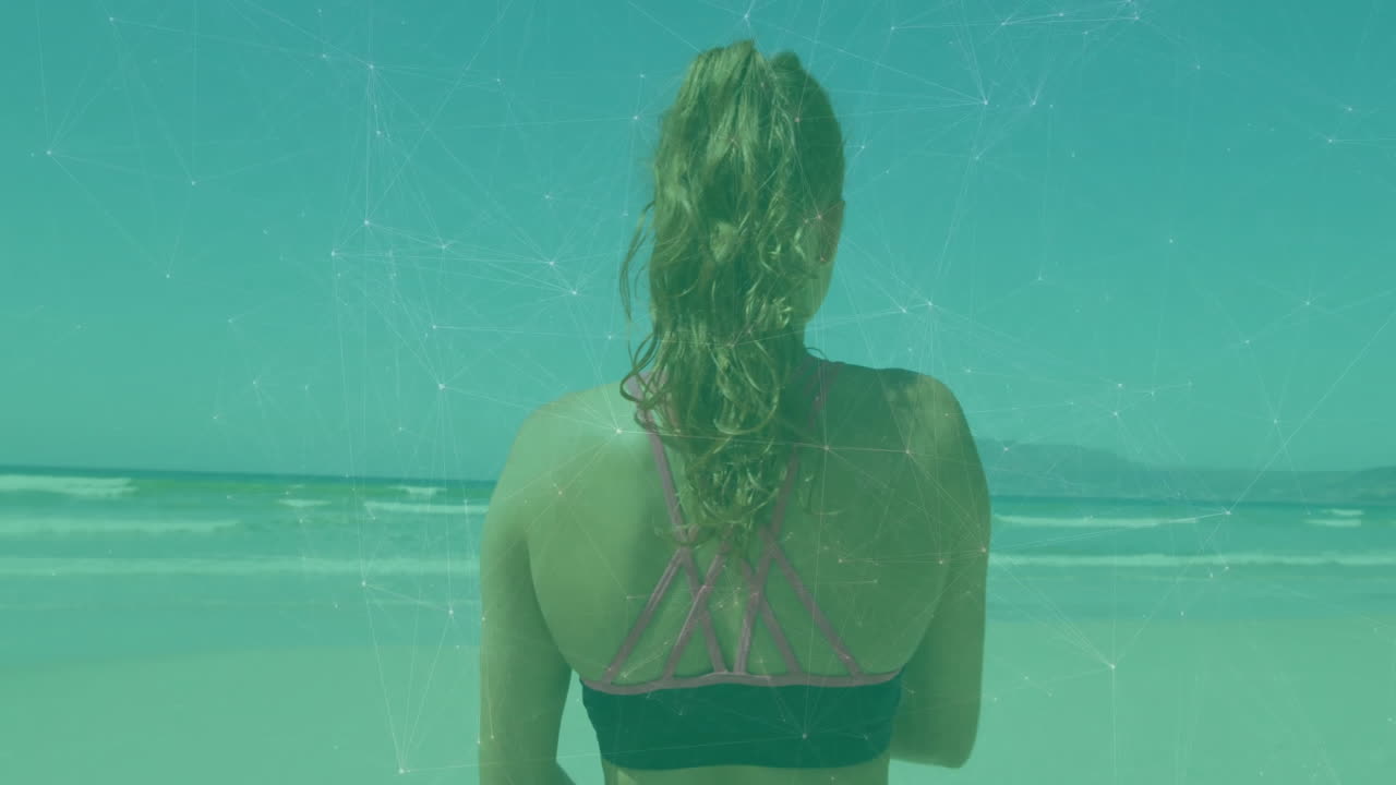 Woman in sportswear facing ocean with network connections animation overlay
