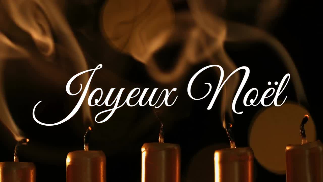 Joyeux No&Atilde;&laquo;l written over candles
