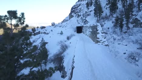 DRONE-VIDEO-OF-ABANDONED-RAILROAD-TUNNELS-ON-MOUNTAIN-PASS-IN-SNOW