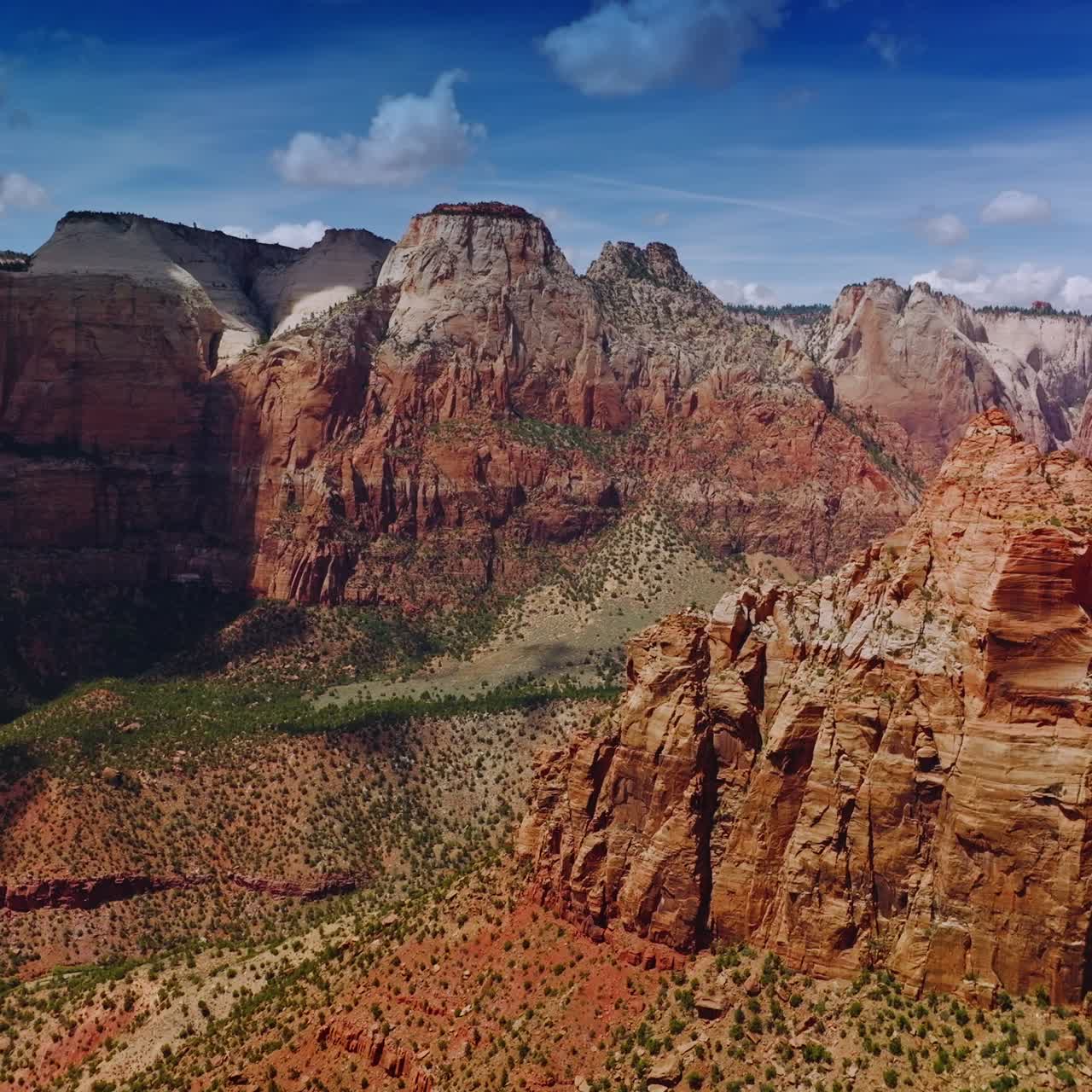Fantastic mountains of canyons in Utah, USA. Shades of clouds falling on the rocks. Aerial view