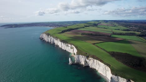 beautiful colourful england coast, aerial footage of white chalk stack and cliffs at old harry rocks, dorset