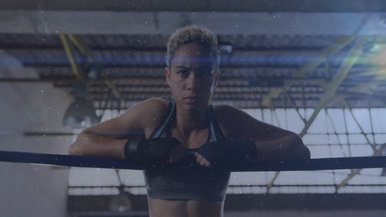 Boxer resting at top rope, camera pull sparking flare showing grip tensing readying for fight