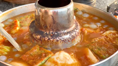 simmering thai soup with vegetables and spices