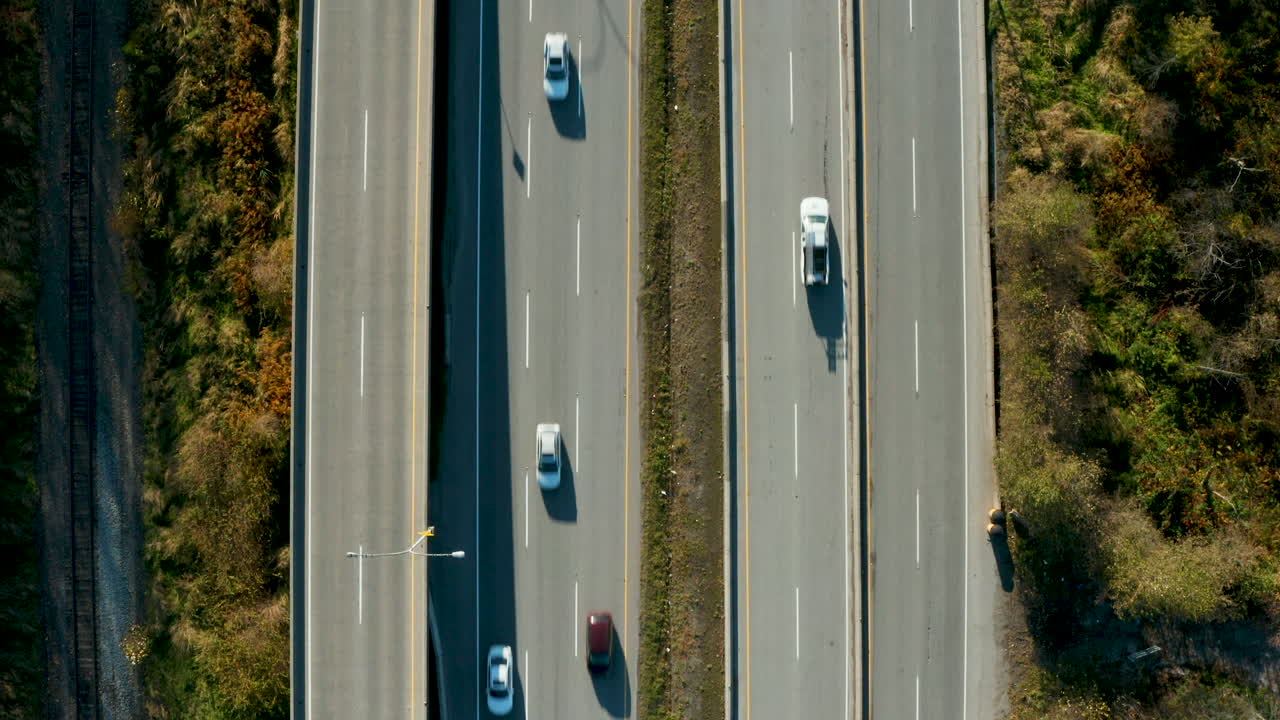 Top down aerial view of cars driving along a busy highway | Premium ...