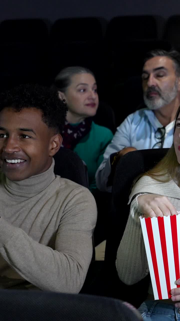People Enjoying a Movie in a Cinema