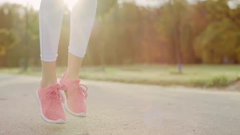 Handheld-view-of-woman’s-legs-starting-up-her-jogging-training