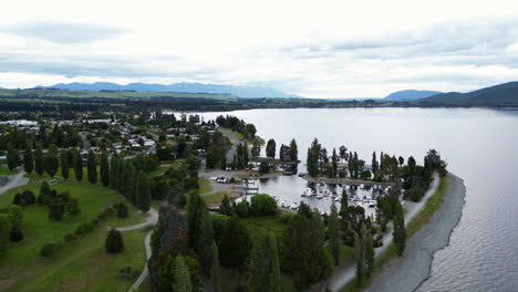 aerial view of a little port of a lake where recreational boats are moored