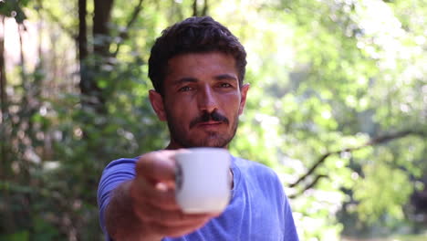 Man-Drinking-Coffee-In-Nature