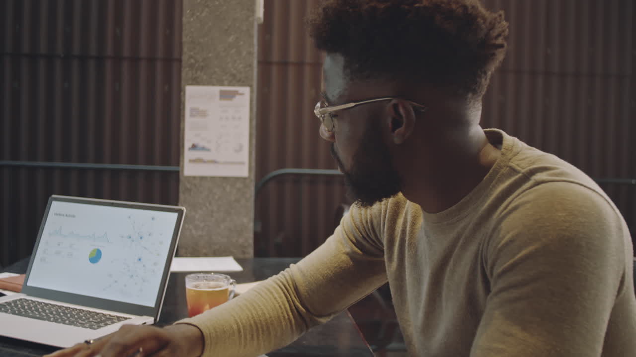 Diverse Colleagues Working Remotely In Freelance-Friendly Cafe