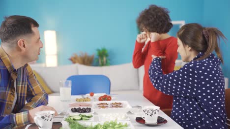 Happy-family-enjoy-breakfast-together.