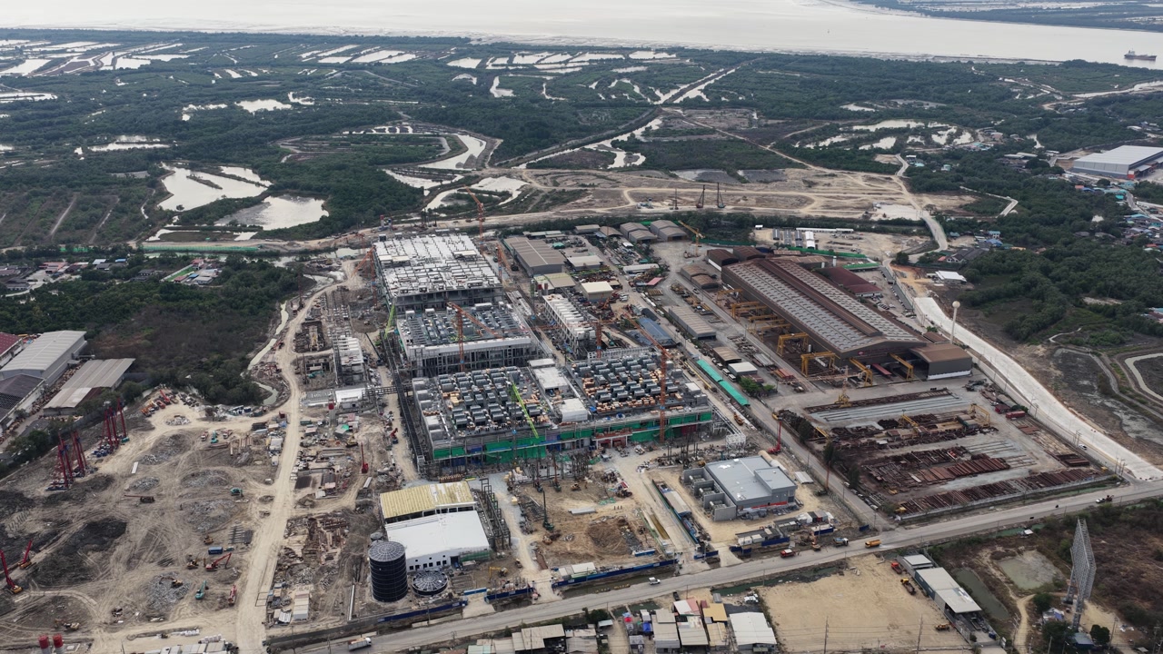Aerial drone video of Data Centre QHI01 hyperscale campus construction in Chonburi, Thailand, within the Eastern Economic Corridor, showing large scale cloud computing, AI infrastructure, and
