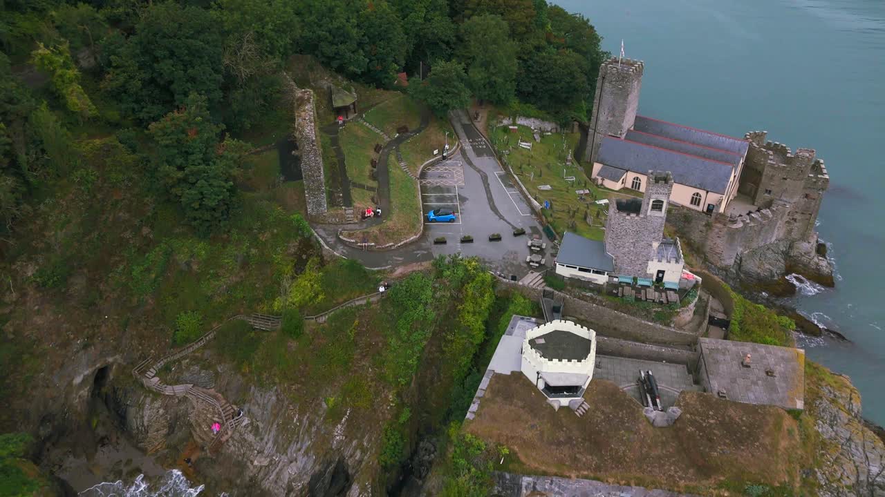 Daytime, aerial reverse over Dartmouth Castle out to sea